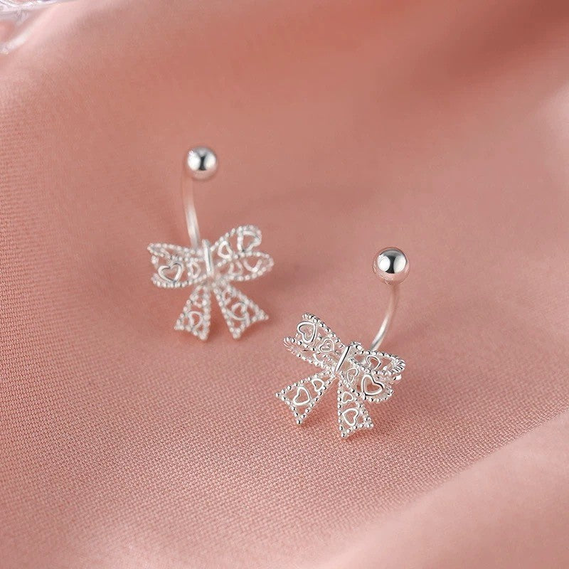 Hollow bow screw earrings