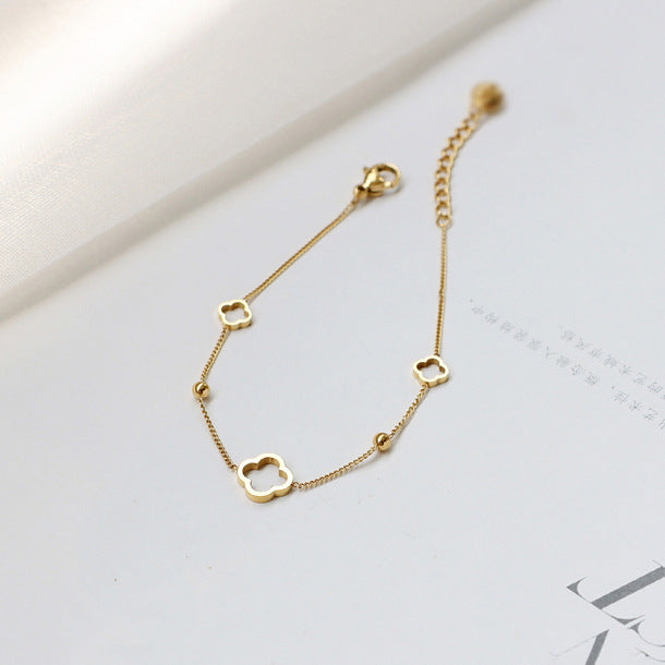 Hollow four-leaf clover titanium steel bracelet